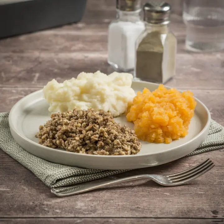 Haggis served with mashed neeps and tatties