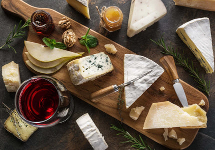 Selection of artisan Scottish cheeses including brie, blue, and cheddar