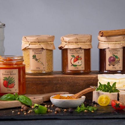 Selection of Scottish condiments including chutneys, mustards, and preserves