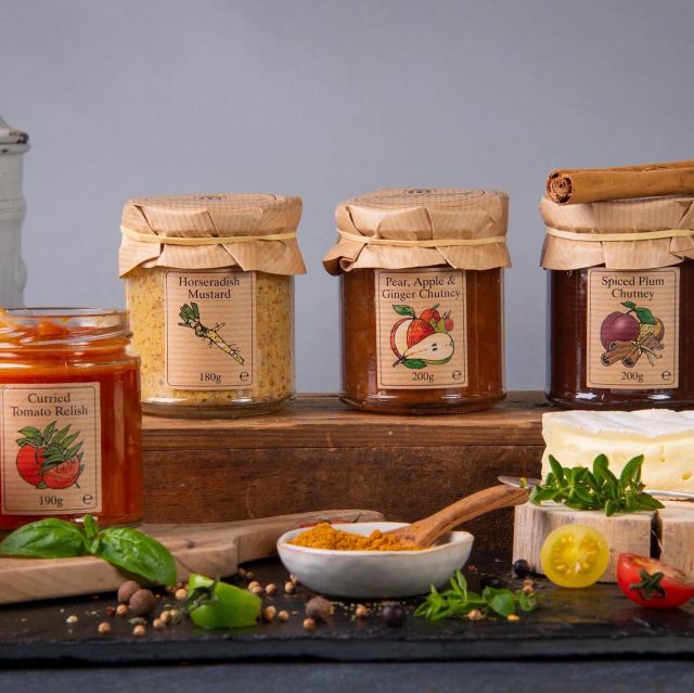 Selection of Scottish condiments including chutneys, mustards, and preserves