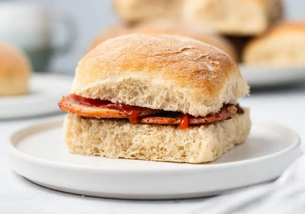 Traditional Scottish morning rolls and Aberdeen butteries (rowies) on wooden board