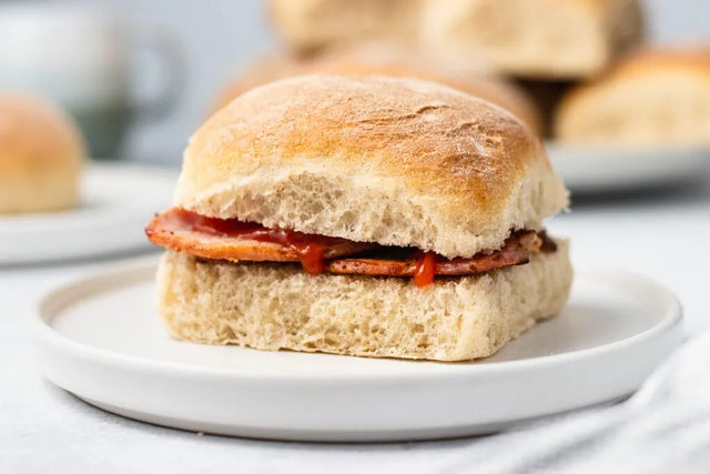 Traditional Scottish morning rolls and Aberdeen butteries (rowies) on wooden board