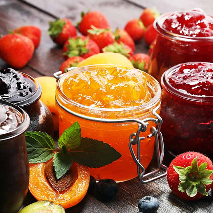 Selection of Scottish preserves including jam and marmalade in glass jars