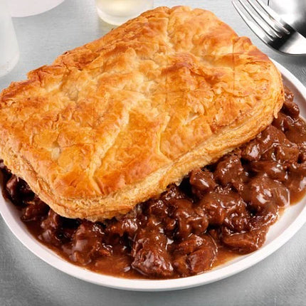 Traditional Scottish steak pie with golden pastry and rich beef gravy