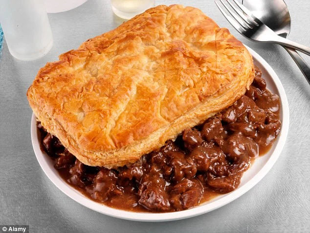 Traditional Scottish steak pie with golden pastry and rich beef gravy
