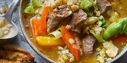 Bowl of traditional Scottish soup with fresh bread