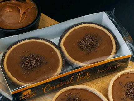 Chocolate tarts in a box with a dark background