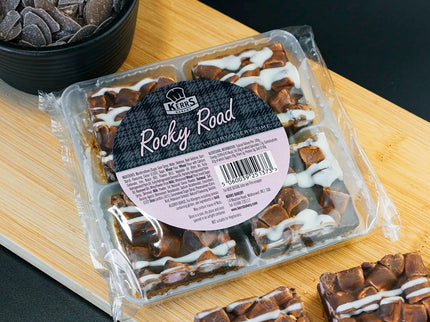 Packaged Rocky Road dessert on a wooden board with a black background