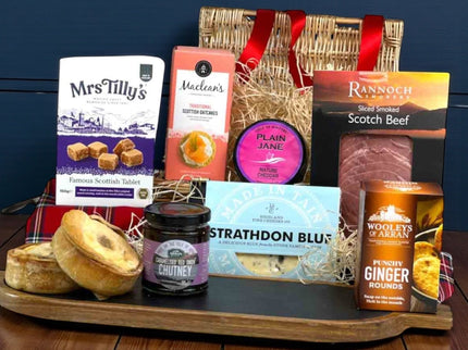 Jura Scottish gift hamper in luxury red tray filled with smoked beef, Scotch pies, Strathdon Blue cheese, Isle of Kintyre cheddar, oatcakes, tablet and artisan Scottish treats.
