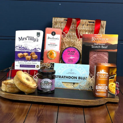 Jura Scottish gift hamper in luxury red tray filled with smoked beef, Scotch pies, Strathdon Blue cheese, Isle of Kintyre cheddar, oatcakes, tablet and artisan Scottish treats.